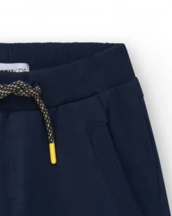 Bermuda bleu marine pour garçon avec taille élastique et imprimé devant.