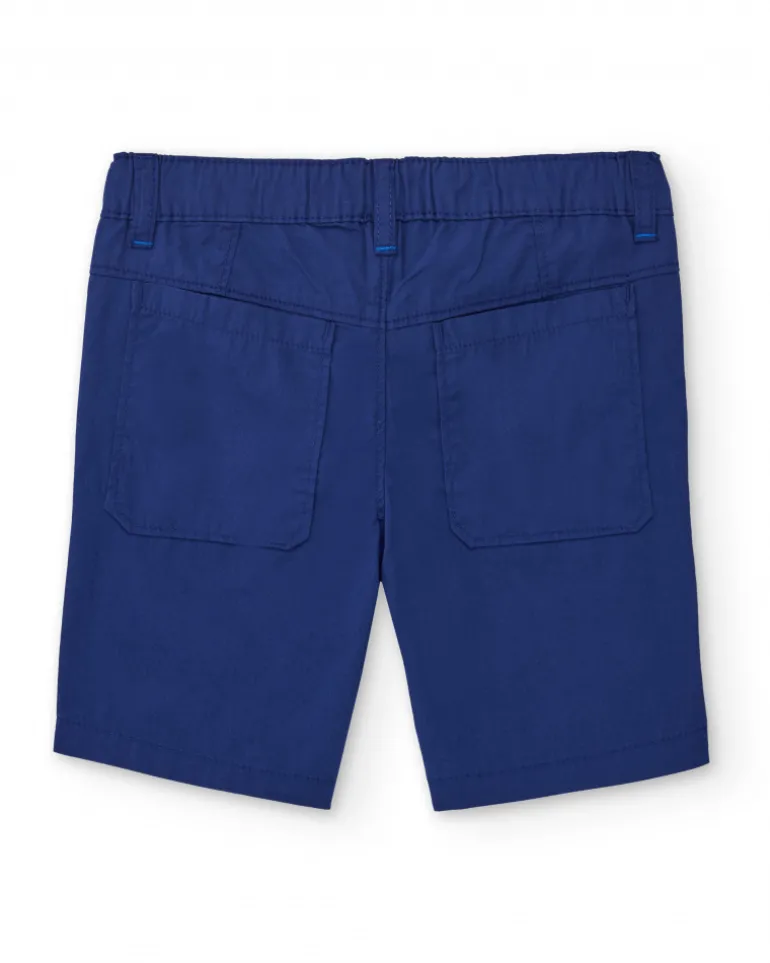 Bermuda para niño en azul con estampado de palmera