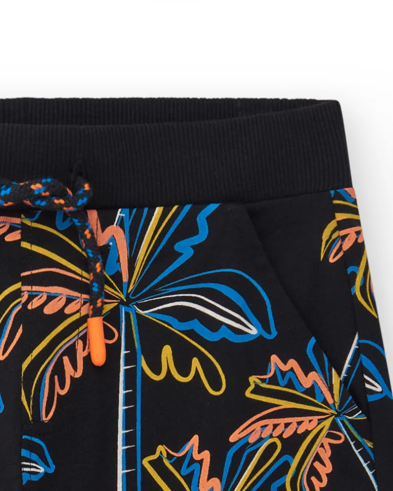 Bermuda pour garçon en noir avec imprimé tropical et taille élastique.