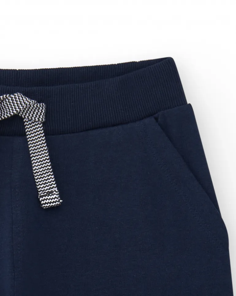 Bermudas pour garçon en bleu avec taille ajustable et poches.