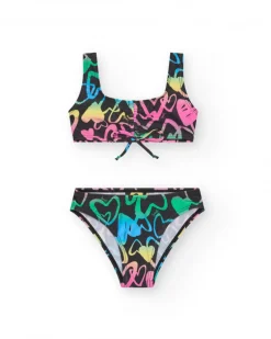 Bikini pour fille en noir avec cœurs imprimés et nœud décoratif.