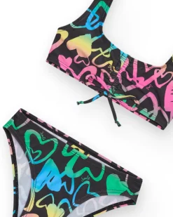 Bikini pour fille en noir avec cœurs imprimés et nœud décoratif.