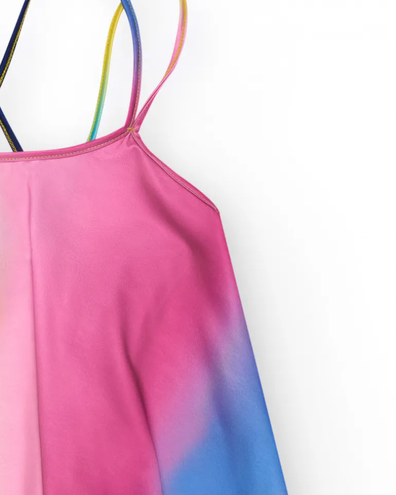 Chemise multicolore pour fille avec bretelles croisées dans le dos.