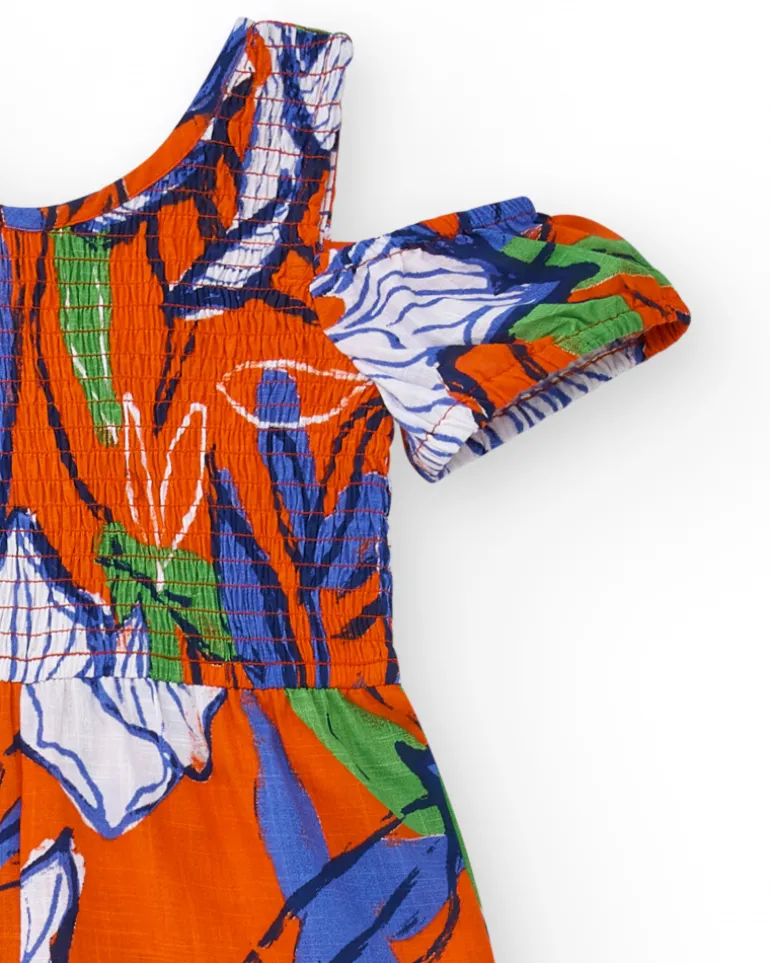 Combinaison longue pour fille en orange avec épaules dénudées.