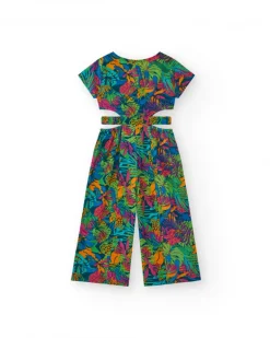 Combinaison pour fille avec imprimé tropical, boutons sur le devant et ouvertures latérales.