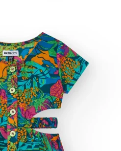 Combinaison pour fille avec imprimé tropical, boutons sur le devant et ouvertures latérales.