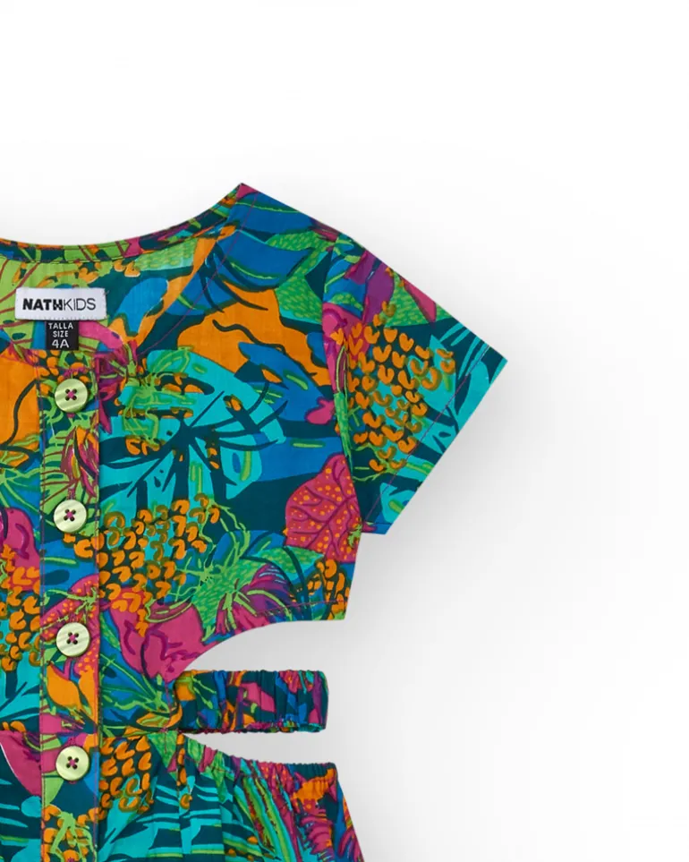 Combinaison pour fille avec imprimé tropical, boutons sur le devant et ouvertures latérales.