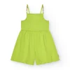 Combinaison pour fille en vert avec bretelles et détails multicolores.