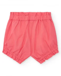 Ensemble blanc et corail pour fille avec t-shirt de feuilles tropicales et shorts froncés