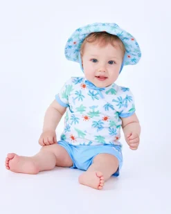 Ensemble pour garçon avec t-shirt blanc de palmiers et soleils et pantalon court bleu