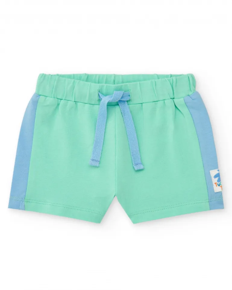 Ensemble pour garçon avec t-shirt blanc à imprimé tropical et shorts verts avec détails bleus