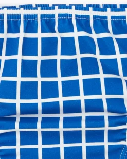 Ensemble pour garçon avec bonnet bleu brodé et culotte à carreaux blancs