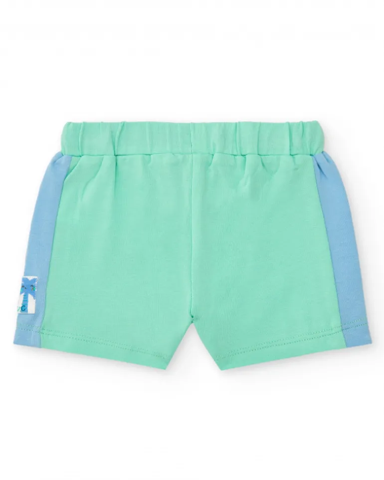 Ensemble pour garçon avec t-shirt blanc à imprimé tropical et shorts verts avec détails bleus