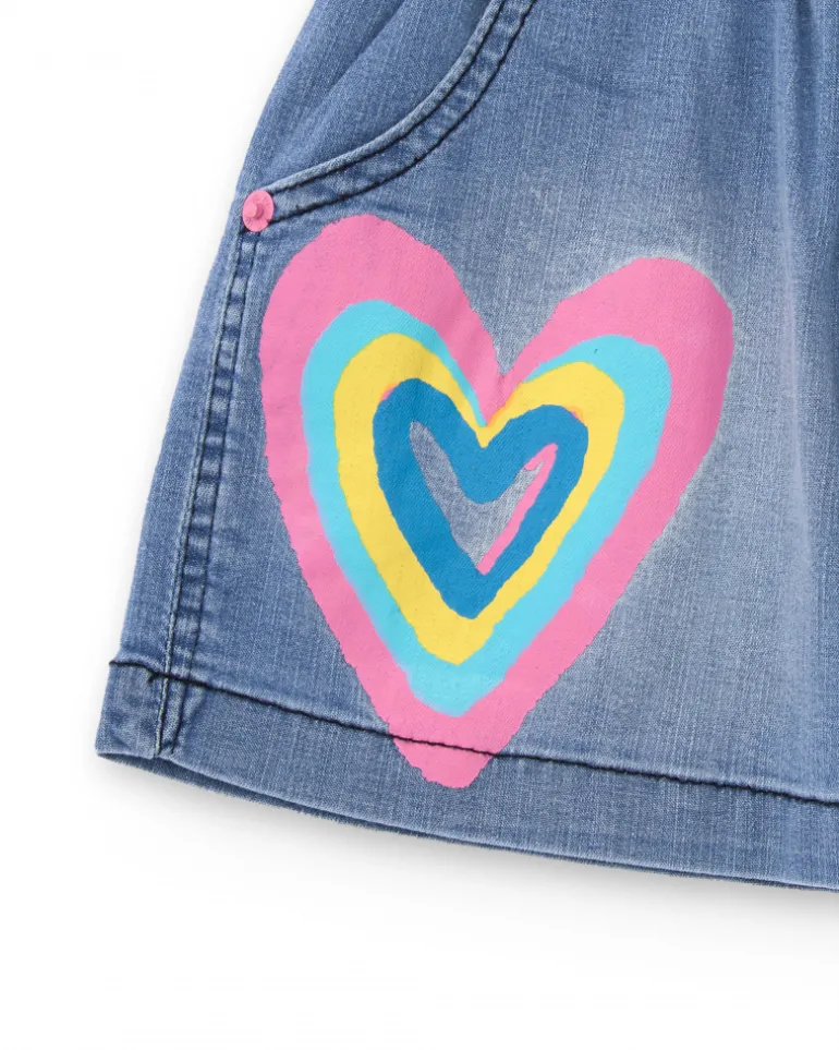 Falda vaquera para niña en azul con estampado de corazón