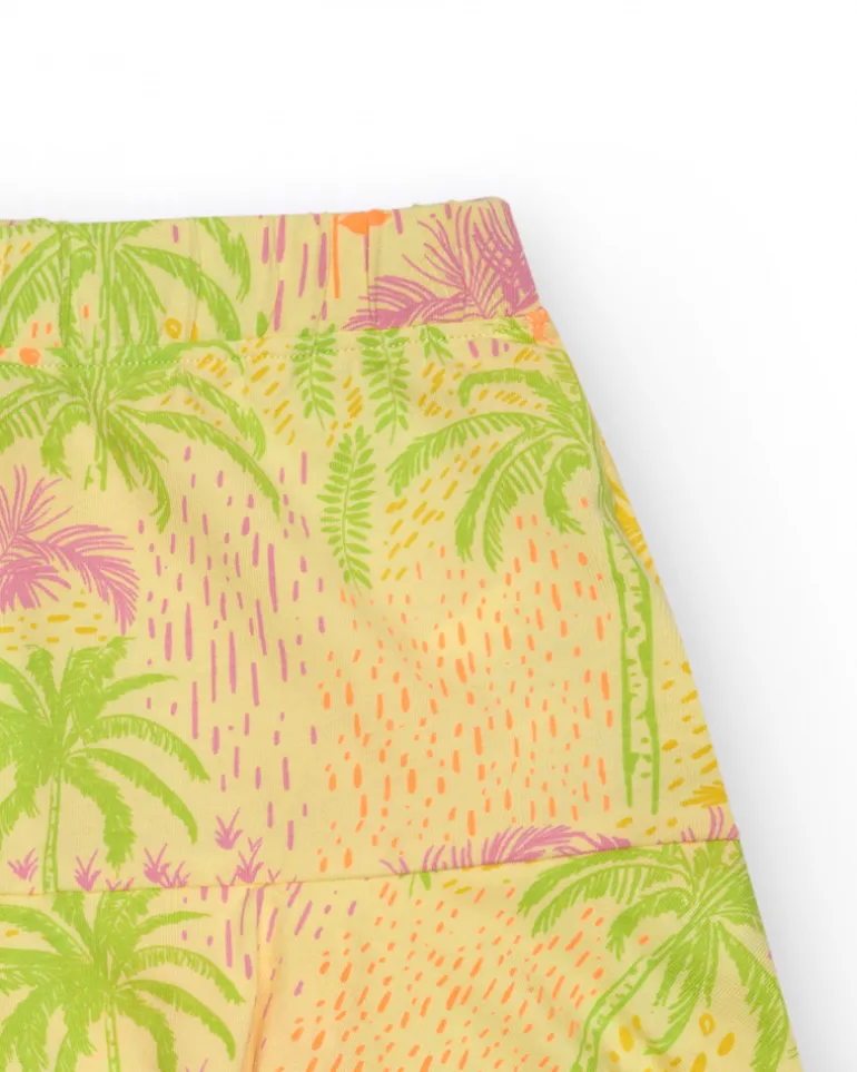Jupe pour fille en jaune avec imprimé tropical et taille élastique.
