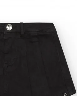 Jupe-short pour fille en noir avec détails métalliques.