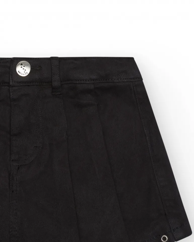 Jupe-short pour fille en noir avec détails métalliques.