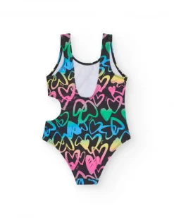Maillot de bain pour fille en noir avec cœurs imprimés et ouverture latérale.