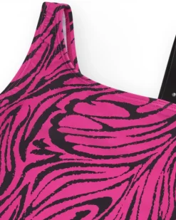 Maillot de bain pour fille en rose avec imprimé animal et design asymétrique.