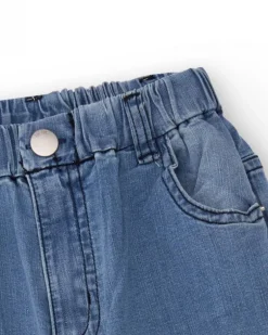 Pantalón vaquero para niño en azul con estampado de palmeras