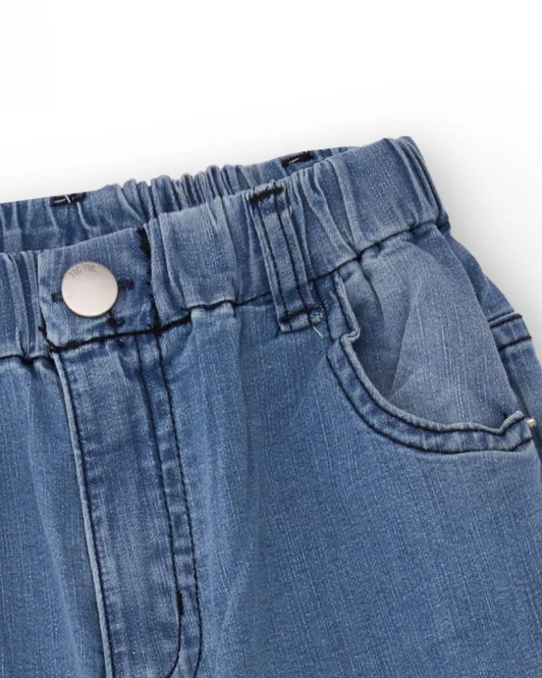 Pantalón vaquero para niño en azul con estampado de palmeras