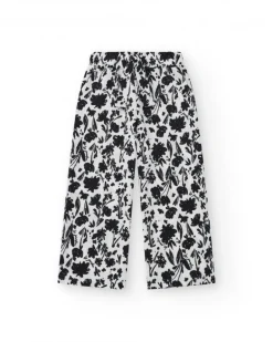 Pantalon pour fille en blanc avec taille élastique et imprimé floral.