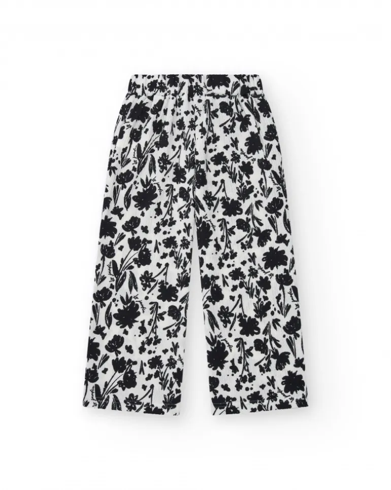Pantalon pour fille en blanc avec taille élastique et imprimé floral.