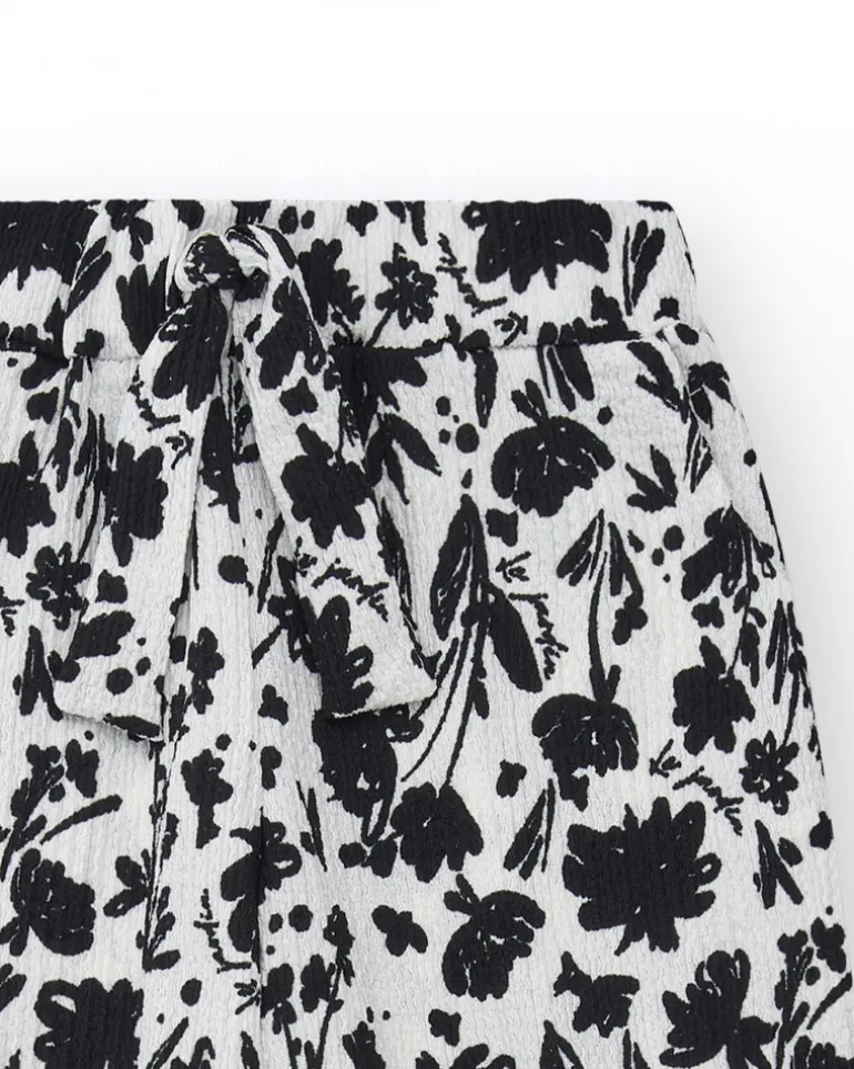 Pantalon pour fille en blanc avec taille élastique et imprimé floral.