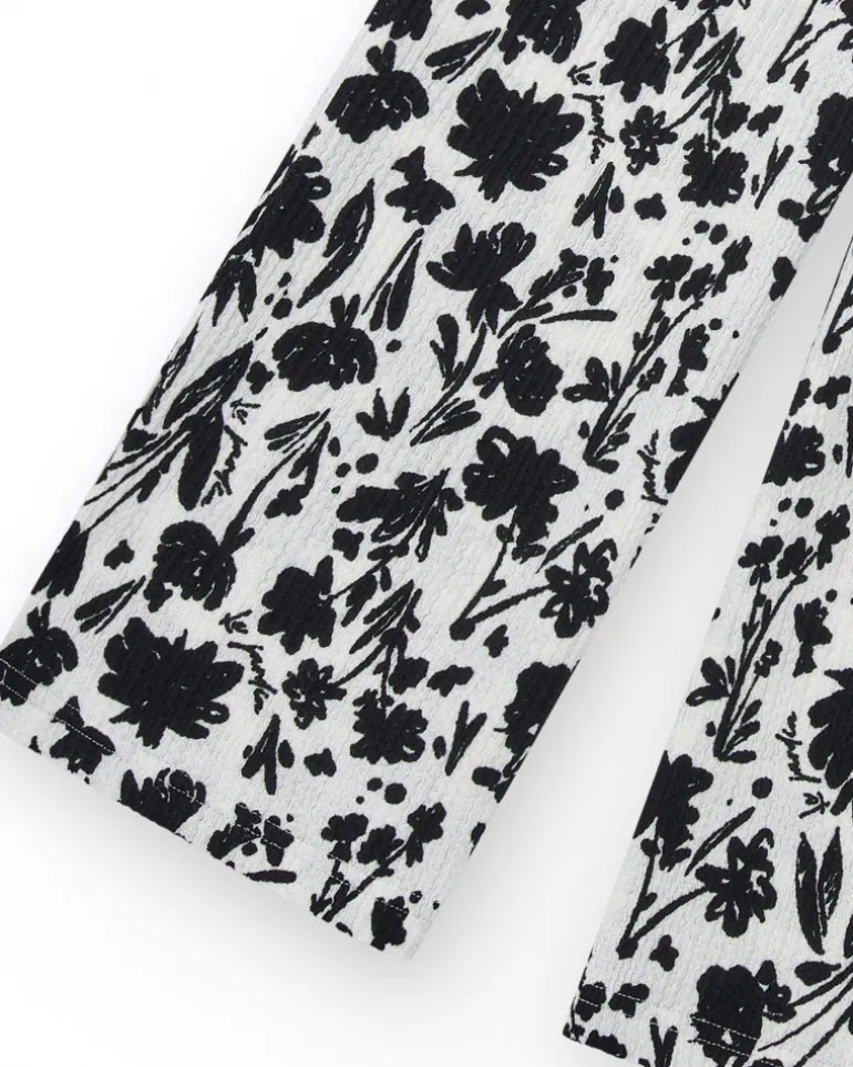 Pantalon pour fille en blanc avec taille élastique et imprimé floral.