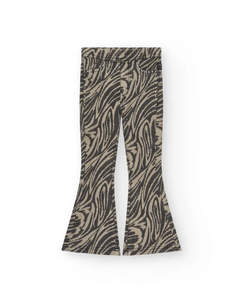 Pantalon pour fille en noir avec imprimé animal et clous à la taille.