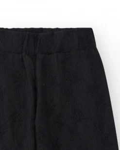 Pantalon pour fille en noir avec taille élastique et broderie.