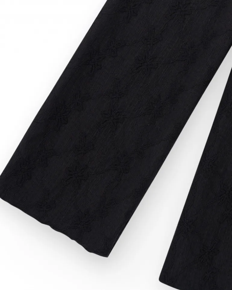 Pantalon pour fille en noir avec taille élastique et broderie.