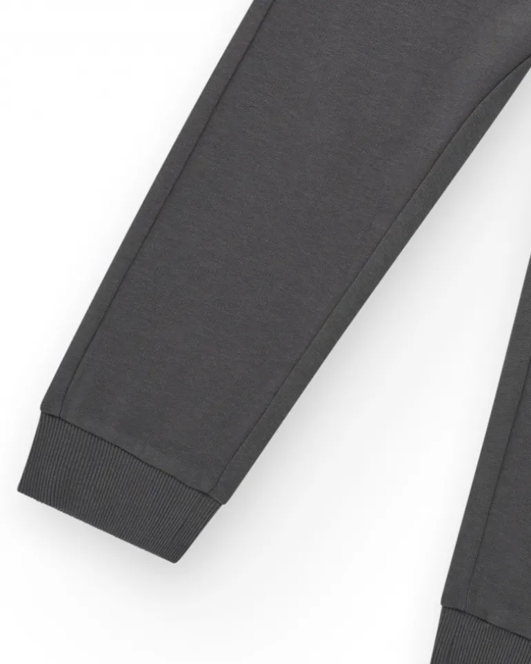 Pantalon pour garçon en gris avec taille élastique et cordon de serrage.