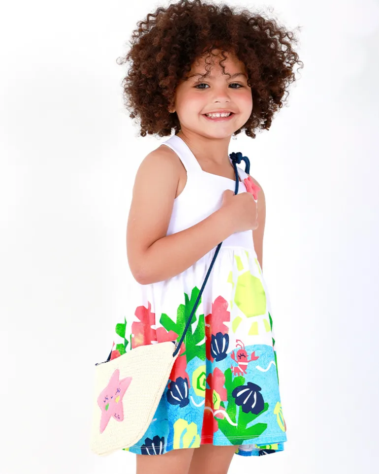 Robe blanche pour fille avec bretelles croisées et jupe fleurie