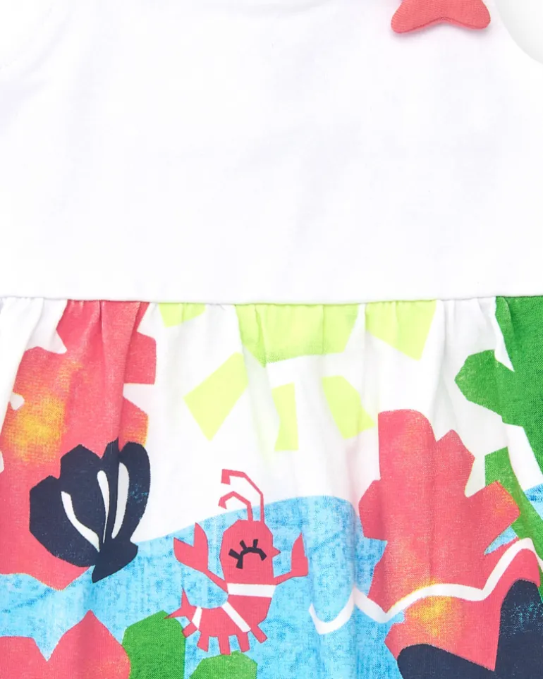 Robe blanche pour fille avec bretelles croisées et jupe fleurie