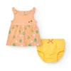 Robe couleur pêche pour fille avec imprimé floral et bretelles nouées