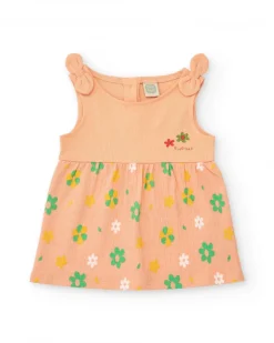Robe couleur pêche pour fille avec imprimé floral et bretelles nouées