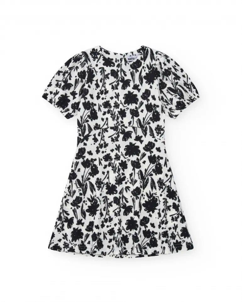 Robe pour fille en blanc et noir avec manches bouffantes et imprimé floral.