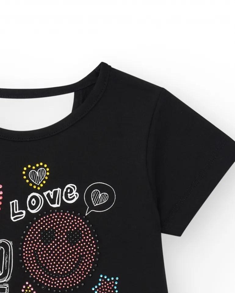 Robe pour fille en noir, à manches courtes, décorée avec des appliques colorées.