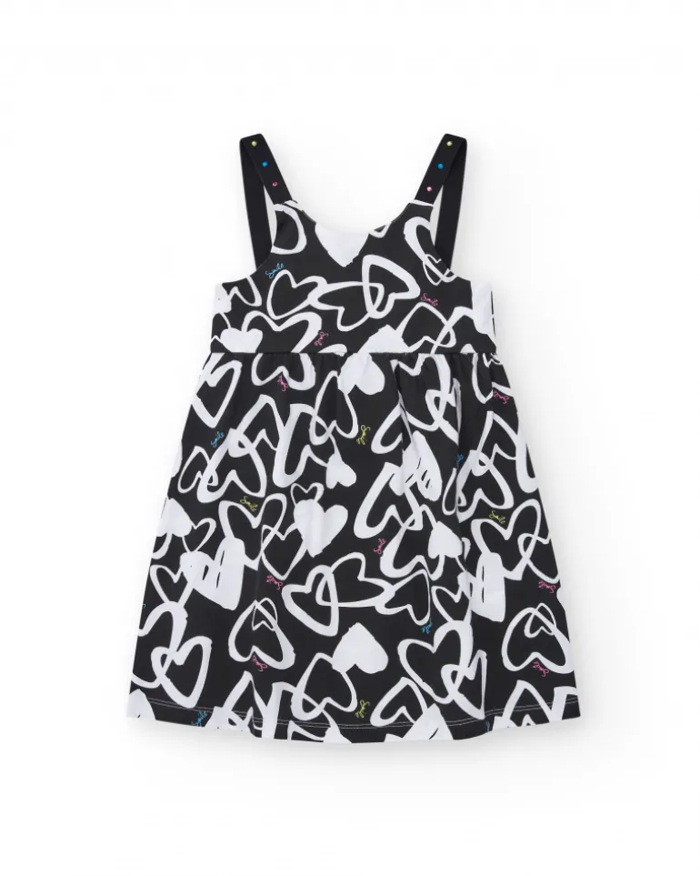 Robe pour fille en noir avec bretelles ajustables et appliques.