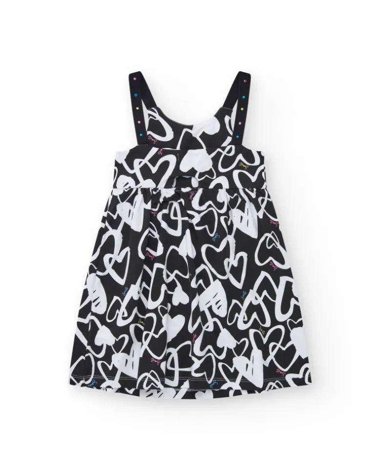 Robe pour fille en noir avec bretelles ajustables et appliques.