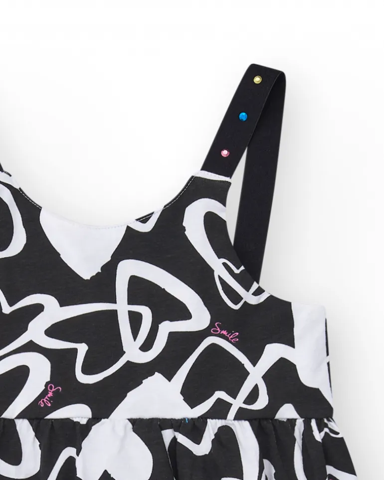 Robe pour fille en noir avec bretelles ajustables et appliques.
