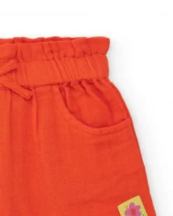 Short orange pour fille avec nœud et poches latérales