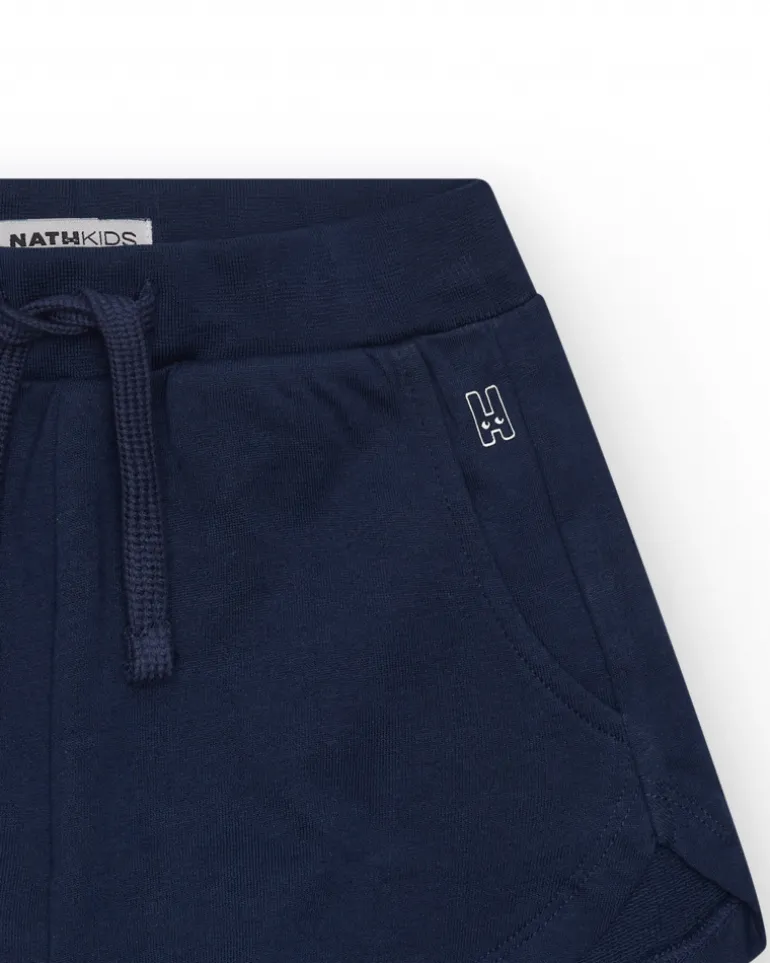 Short pour fille en bleu avec taille élastique et poches.