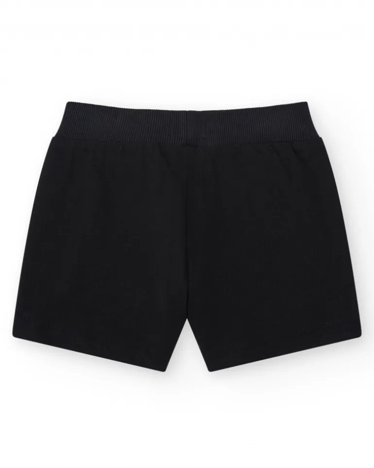 Short pour fille en noir avec taille élastique et poches.