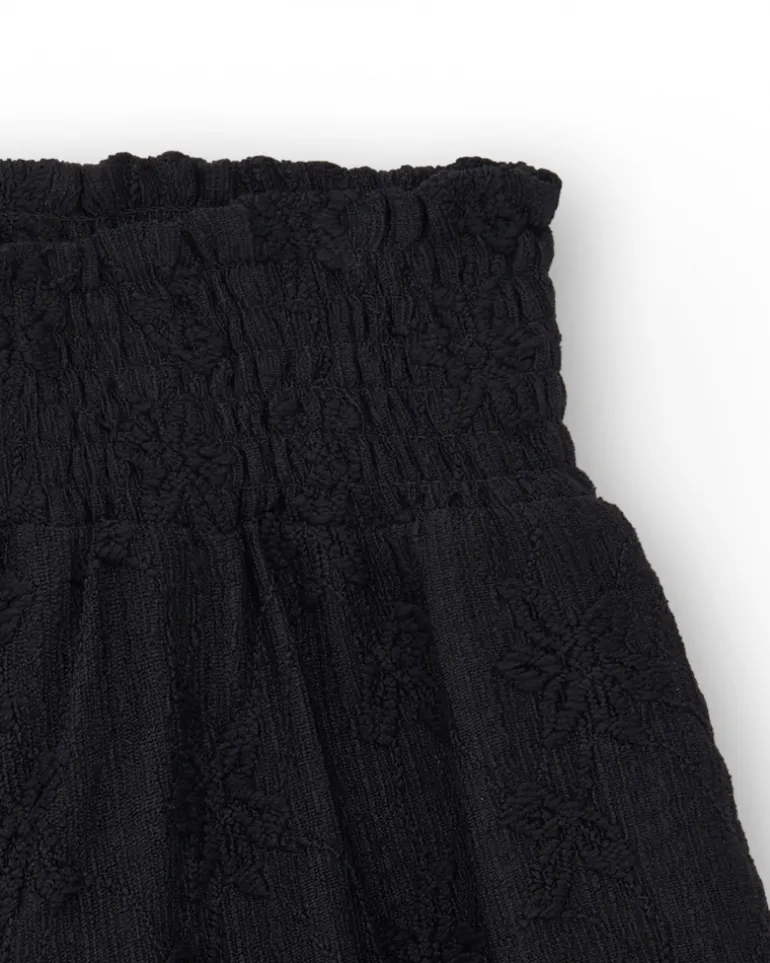 Short pour fille en noir avec taille élastique et imprimé floral.