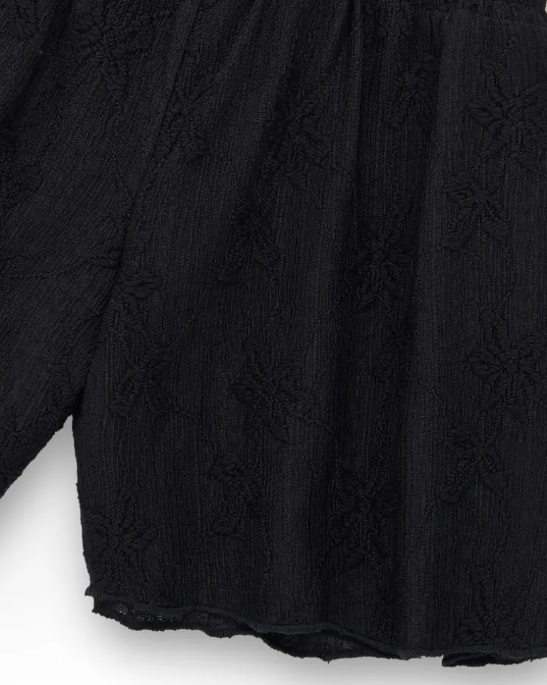Short pour fille en noir avec taille élastique et imprimé floral.