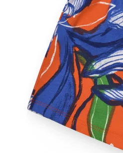 Short pour fille en orange avec taille élastique et imprimé floral.