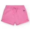 Short pour fille en rose fuchsia avec taille élastique et poches.