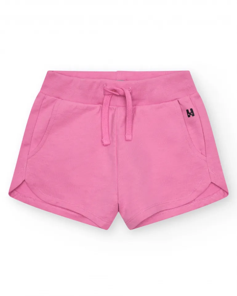Short pour fille en rose fuchsia avec taille élastique et poches.